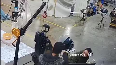 Eerie moment when a humanoid robot comes to life and begins assaulting its operators in China.