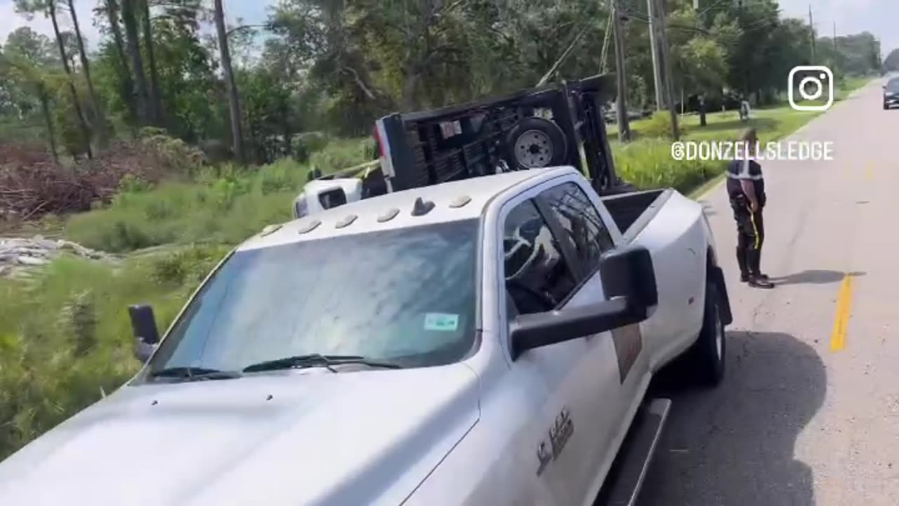5 car hauler overturned in ditch