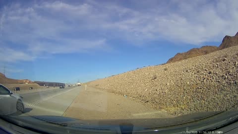 White Sedan Merging Onto Highway Crashes Into Soil Truck