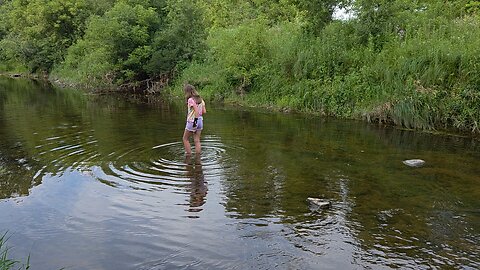 Lily fishing in the Eau Galle River on the family farm