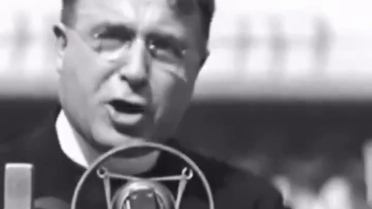 Father Charles Coughlin giving a speech in the 1930's mostly in opposition of the federal reserve