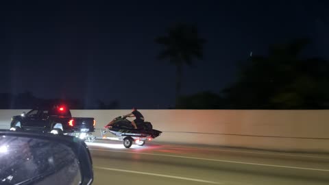 Riding a Jet Ski Down the Highway