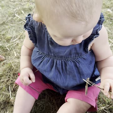 baby kayla playing with hay – sweetest outdoor moment