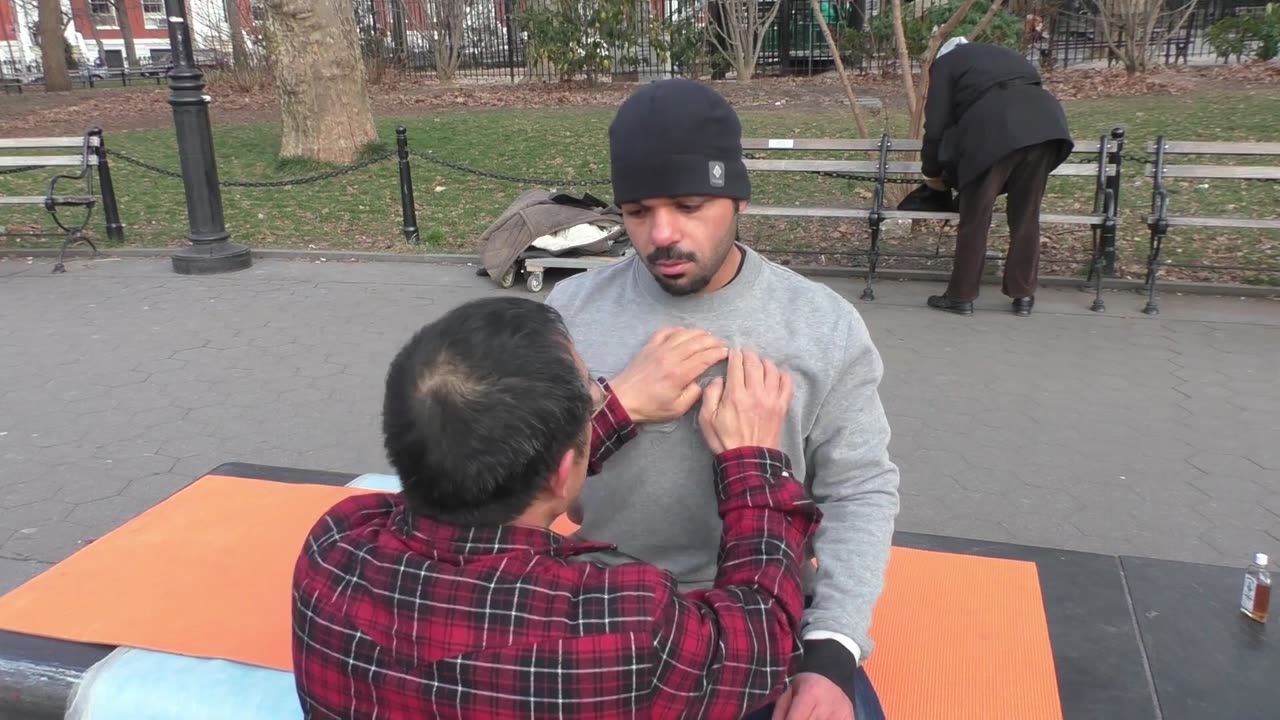 Luodong Briefly Massages Man In Winter Hat At Washington Square Park