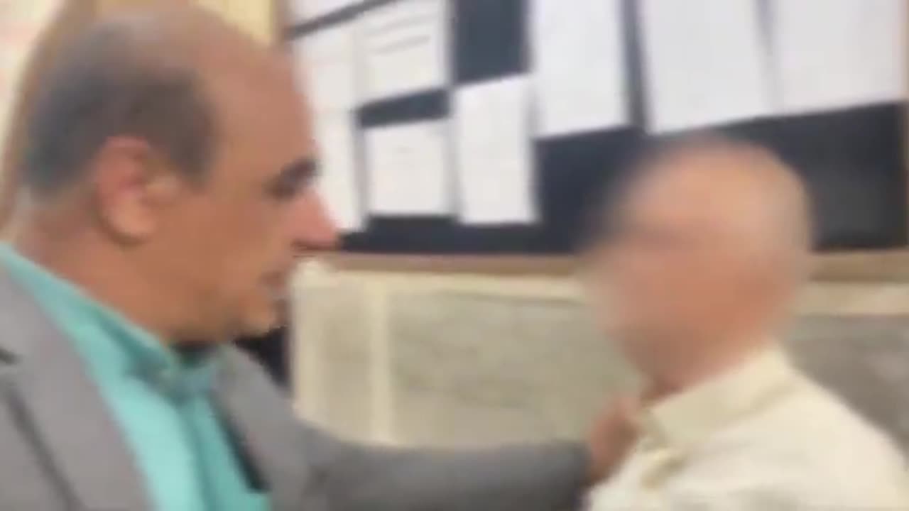 Iran TV from inside Evin Prison. (It appears to be holding cells in court)