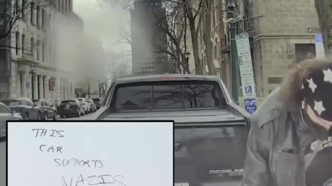 Masked New Yorker vandalizes a Tesla. “This car supports Nazis”