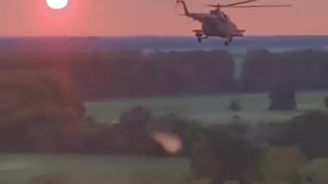 Pair of Ukrainian Helicopters Moving Across Horizon and Sunset