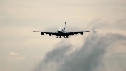 The giant Airbus A380-800 disperses clouds during landing at Zurich Airport, Switzerland