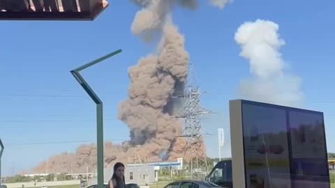 Buses, cars and nearby houses are burning