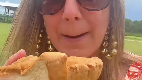 American goes out to feed her chickens their leftover bread and then looks at the date