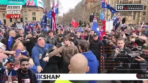 Avi Yemeni from Rebel News tries to make "March For Australia" about multiracial kumbaya ... is shown the door by Thomas Sewell's lads.