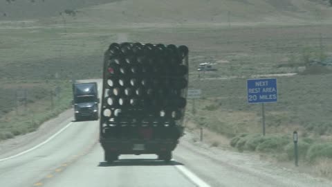Funky truck with pipes on the back is LEANING!!!!! Kinda scary!