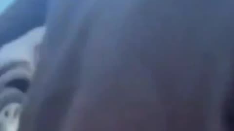 ICE violently detain woman driver—goes to draw gun on another woman filming.