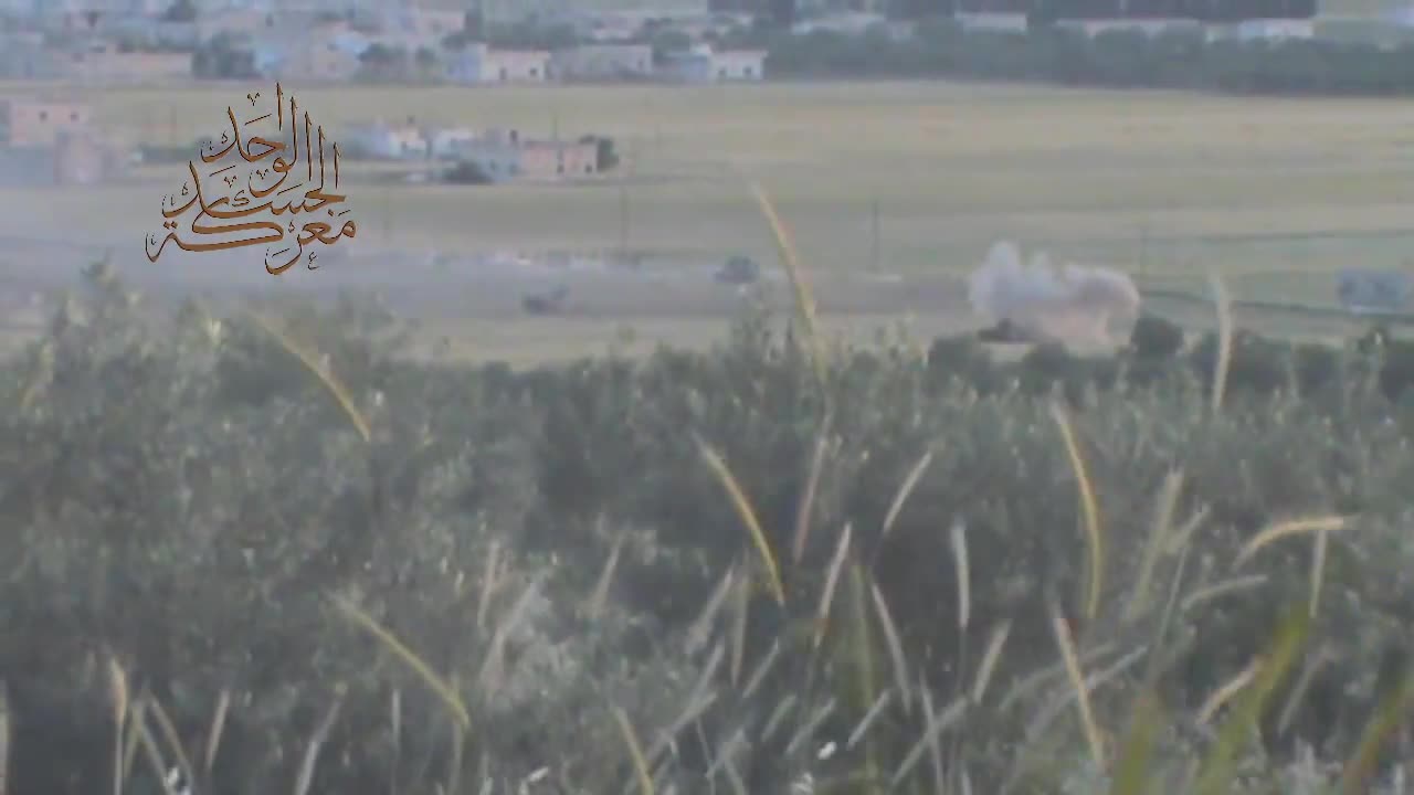 Syria War N. Hama, Rebels shooting RPGs at regimes armored vehicles 2013.05.02