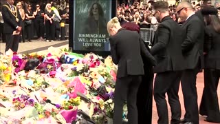 Tearful Sharon Osbourne lays flowers for late husband Ozzy