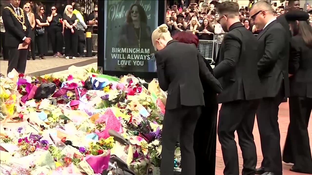 Tearful Sharon Osbourne lays flowers for late husband Ozzy