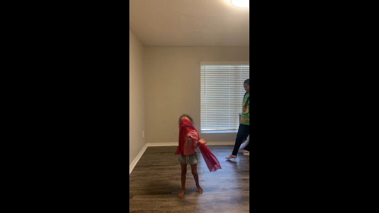 Twirling in faith and joy—every swirl with my granddaughter is a moment wrapped in love and hope.