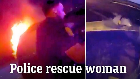TAMPA OFFICERS SAVE WOMAN FROM BURNING CAR