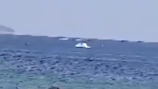 An ultralight plane pulling an advertising banner crashed into the sea off Copacabana beach