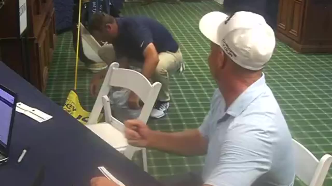 Tossing down a hat and book as toys to buy 2 minutes—elite dad move.