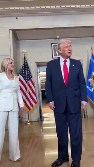 Trump pauses to view his portrait at the Justice Department: 'That's a tough picture'