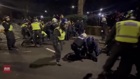 Clashes reported as police detain anti-Iranian regime protesters in London, England.