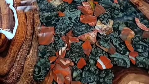 AMAZING TABLE - River table with colored rocks in distressed wood.