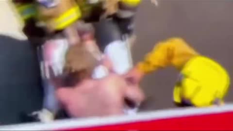 Actress Anne Heche zips herself out of a body bag
