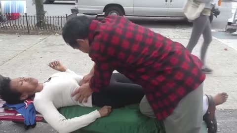Luodong Massages Black Woman With Short Hair On The Street Bench