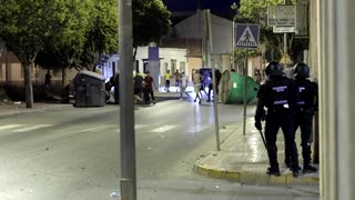 Anti-migrant groups clash with riot police in southeastern Spain