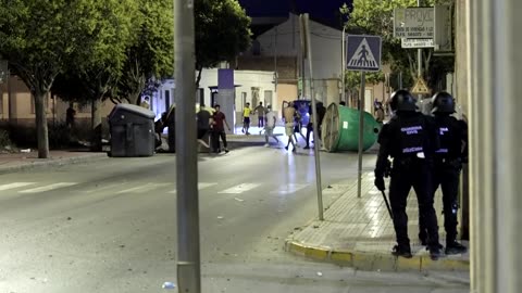 Anti-migrant groups clash with riot police in southeastern Spain