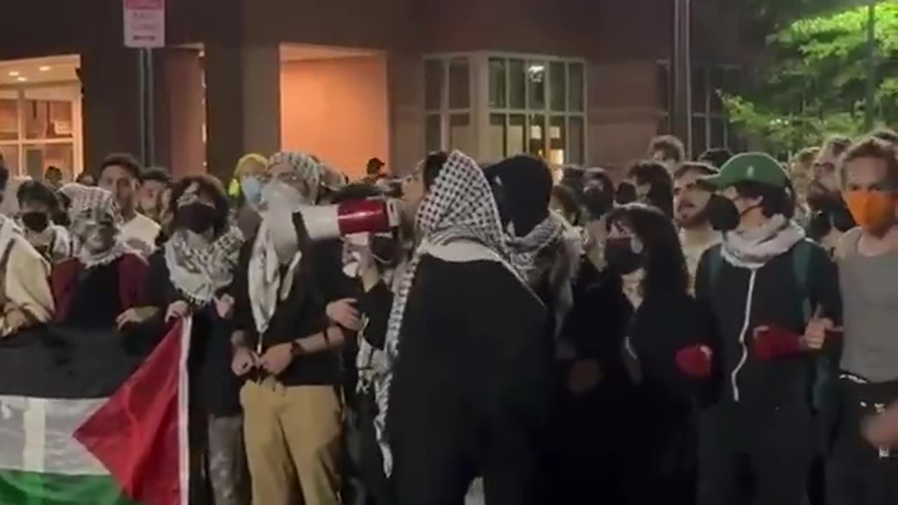 Please meet Zara Raven, she is leading a crowd in chanting “globalize the intifada