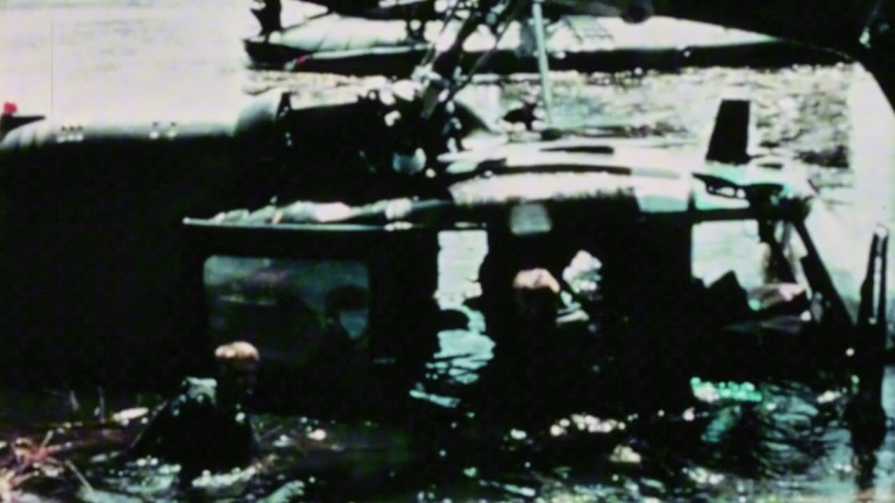 PACV crews on the Mekong Delta recover weapons and ammunition from a downed UH-1 Huey in 1966