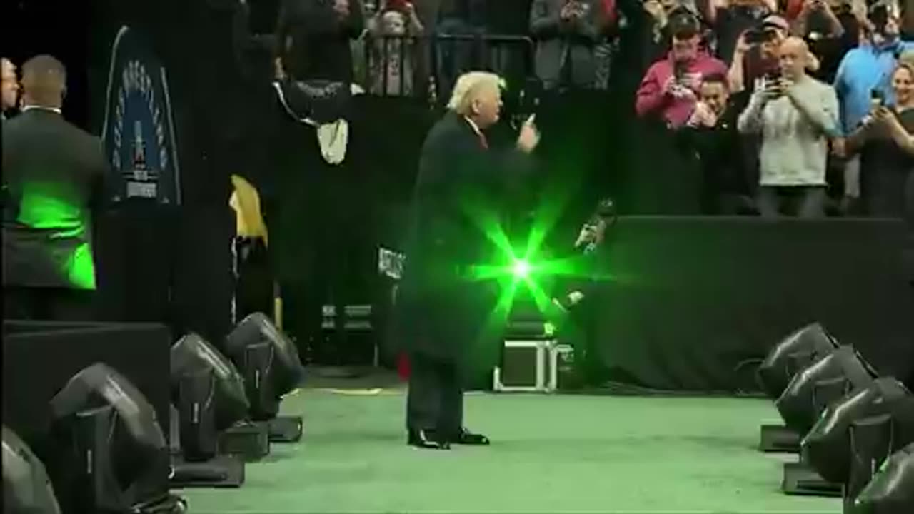 Trump greeted with huge cheers from ecstatic crowd as he attends NCAA wrestling championships