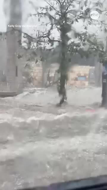 raging river as severe thunderstorms in Austin as the city was battered by golf ball-sized hail.