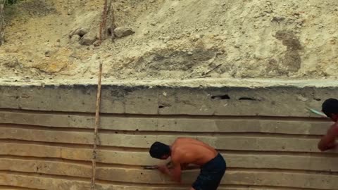 Two men build a cozy house and swimming pool with their own hands