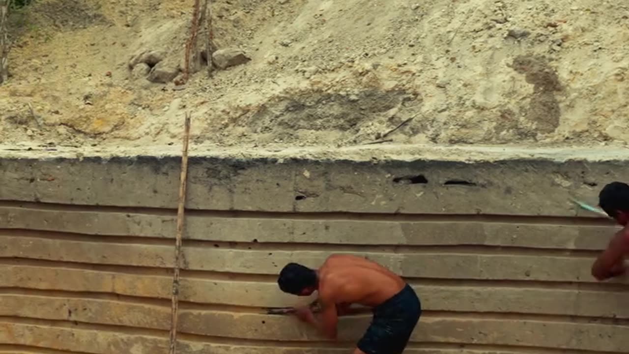 Two men build a cozy house and swimming pool with their own hands