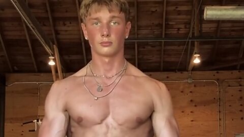 Handsome muscular man showing off his muscles