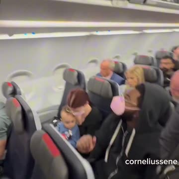 He films RFK Jr taking his seat in a basic economy seat.