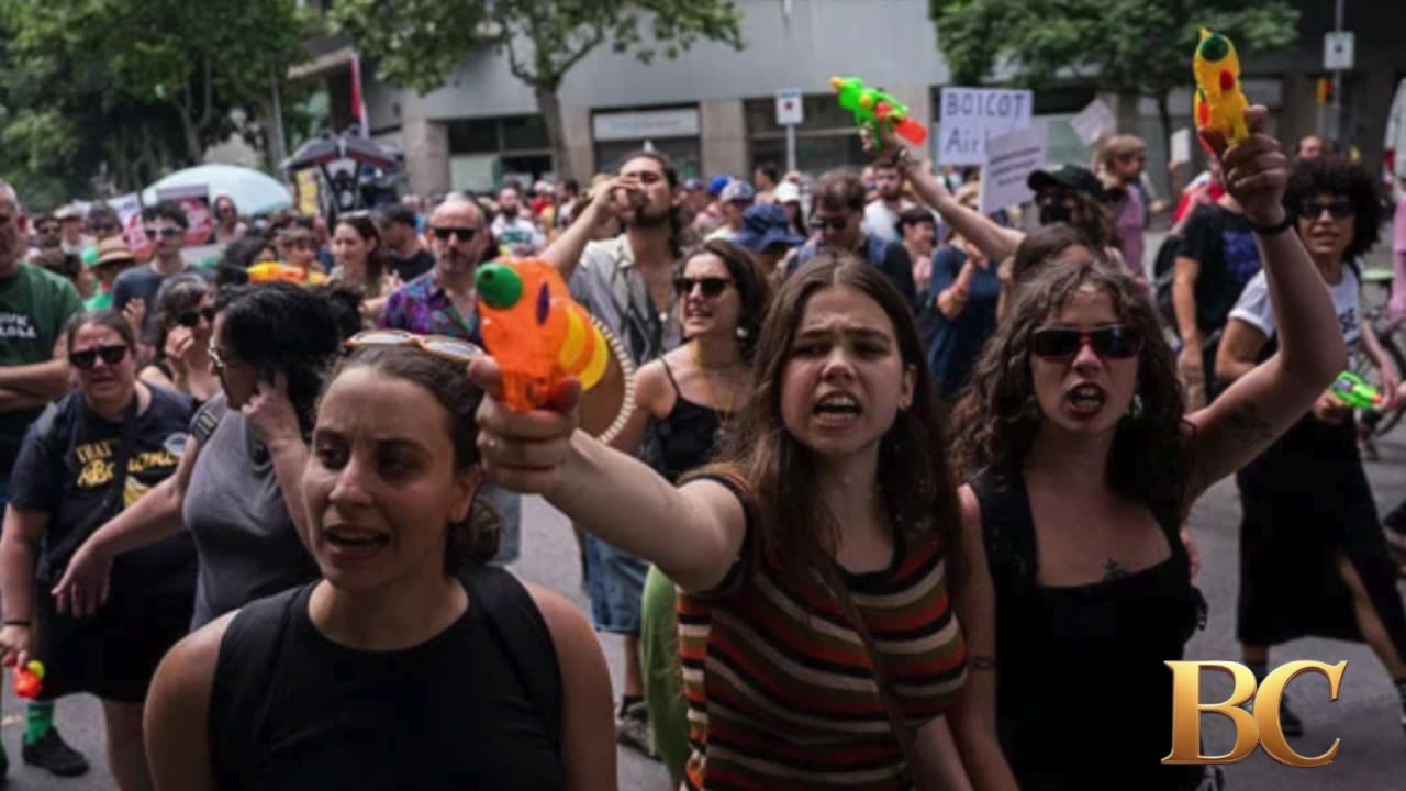 Protesters in Spain shoot water guns at tourists
