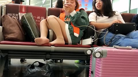 Chinese gals waiting for their train...