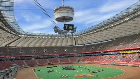 Warsaw National Stadium's retractable roof structure is 240 × 270 m and the central spire stands at 100 meters above the pitch
