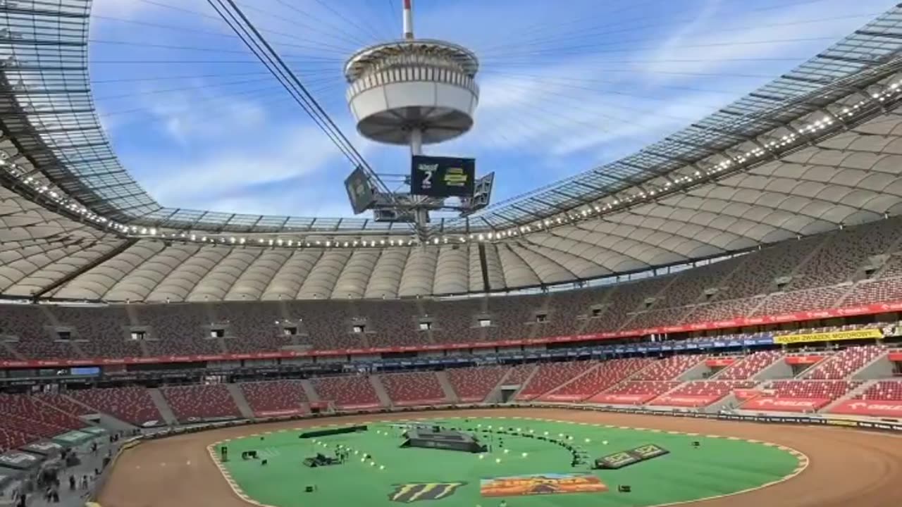 Warsaw National Stadium's retractable roof structure is 240 × 270 m and the central spire stands at 100 meters above the pitch