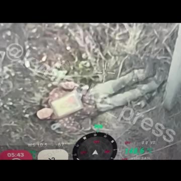 Russian Soldier Lays A Looted Icon Across His Chest and Waits for Drone