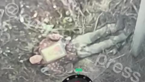 Russian Soldier Lays A Looted Icon Across His Chest and Waits for Drone