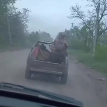 Russian Soldier Dumped Out the Back of Moving Vehicle