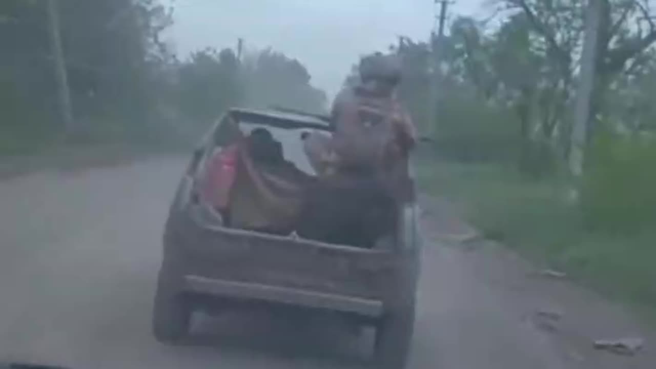 Russian Soldier Dumped Out the Back of Moving Vehicle