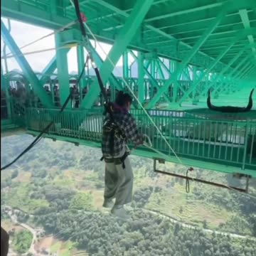 Bungee jumping has opened in China from the new 625-meter Huajiang Canyon Bridge