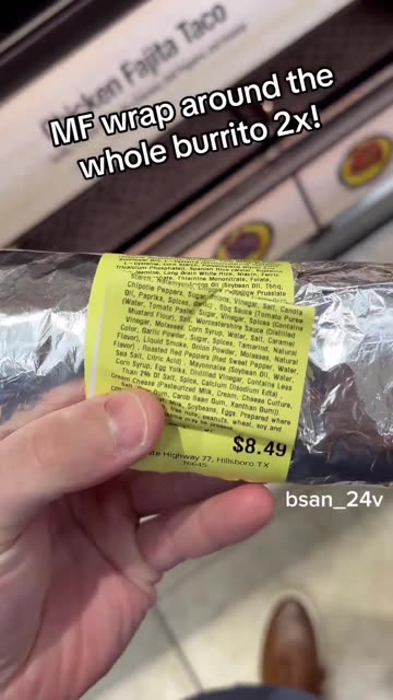 An American grabs food at a gas station. He buys a “chicken burrito....