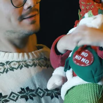 Excited girl with a stuffed Santa Claus